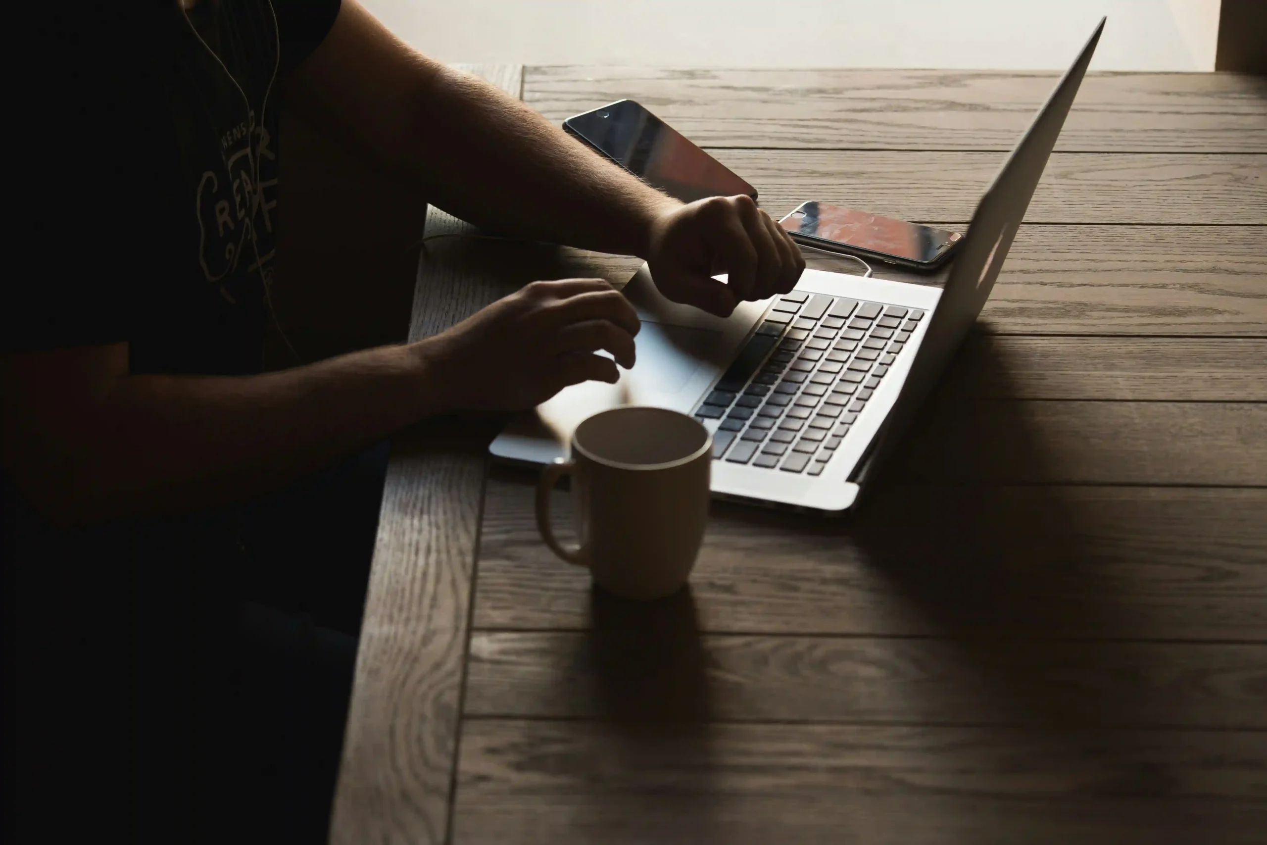 Person researching on laptop representing eHarmony compatibility test review